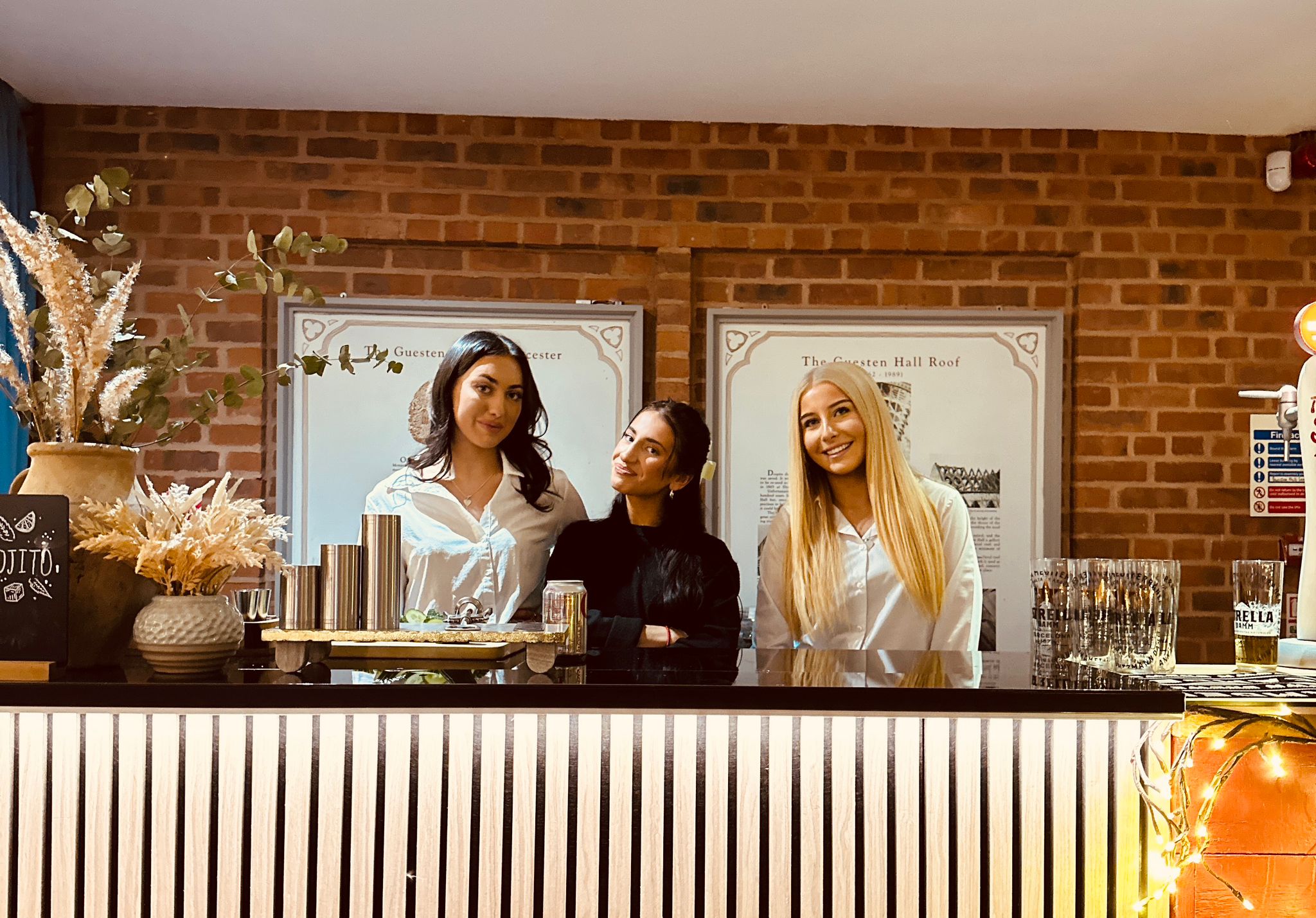 No.3a pop-up bar team behind a lit bar at an event